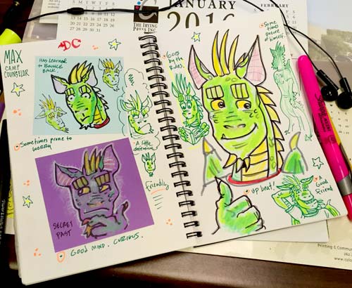 Photo of the sketch book spread showing various drawings of Max the Dragon